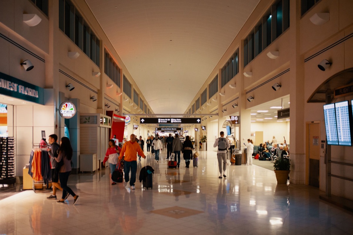 Guam airport terminal with luggage and passengers