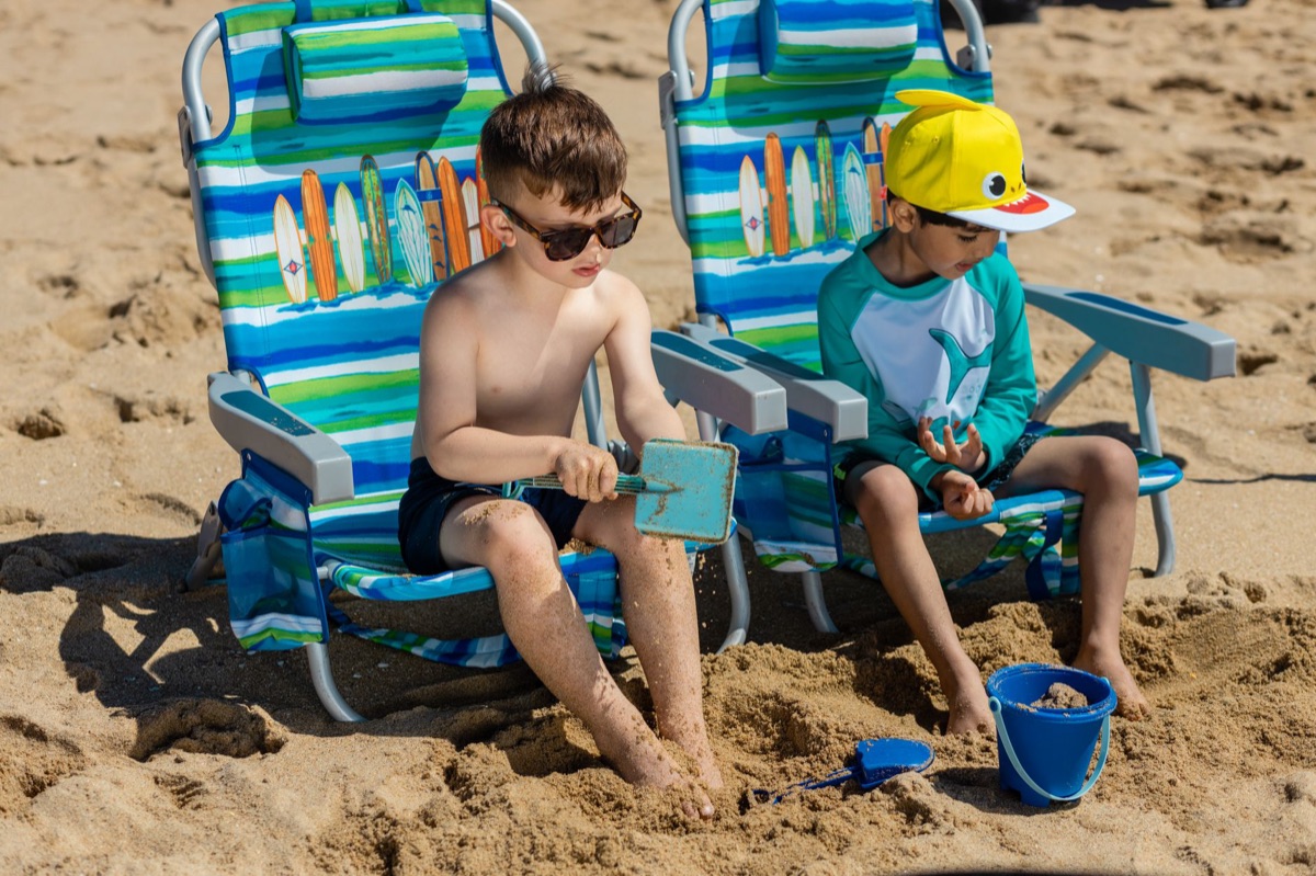 beach chair with children on gulf beach