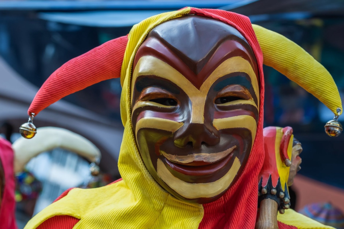 A carved wooden mask, symbolizing the traditional art and cultural practices of the Chamorro people.